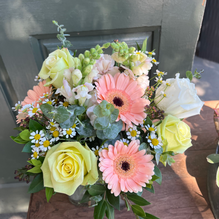 A medium custom vase arrangement with pink and white flowers.