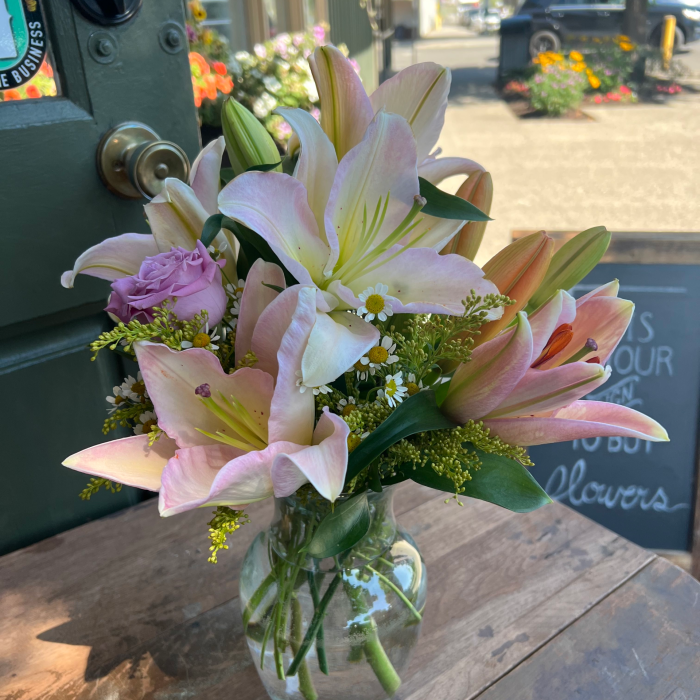 A medium custom vase arrangement with pink and white flowers.